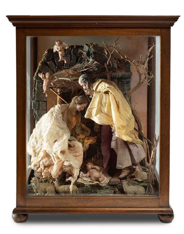Gruppo della Natività entro teca in legno e vetro
