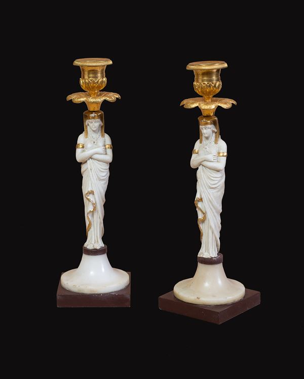 Pair of candlesticks in biscuit, gilded bronze and marble 