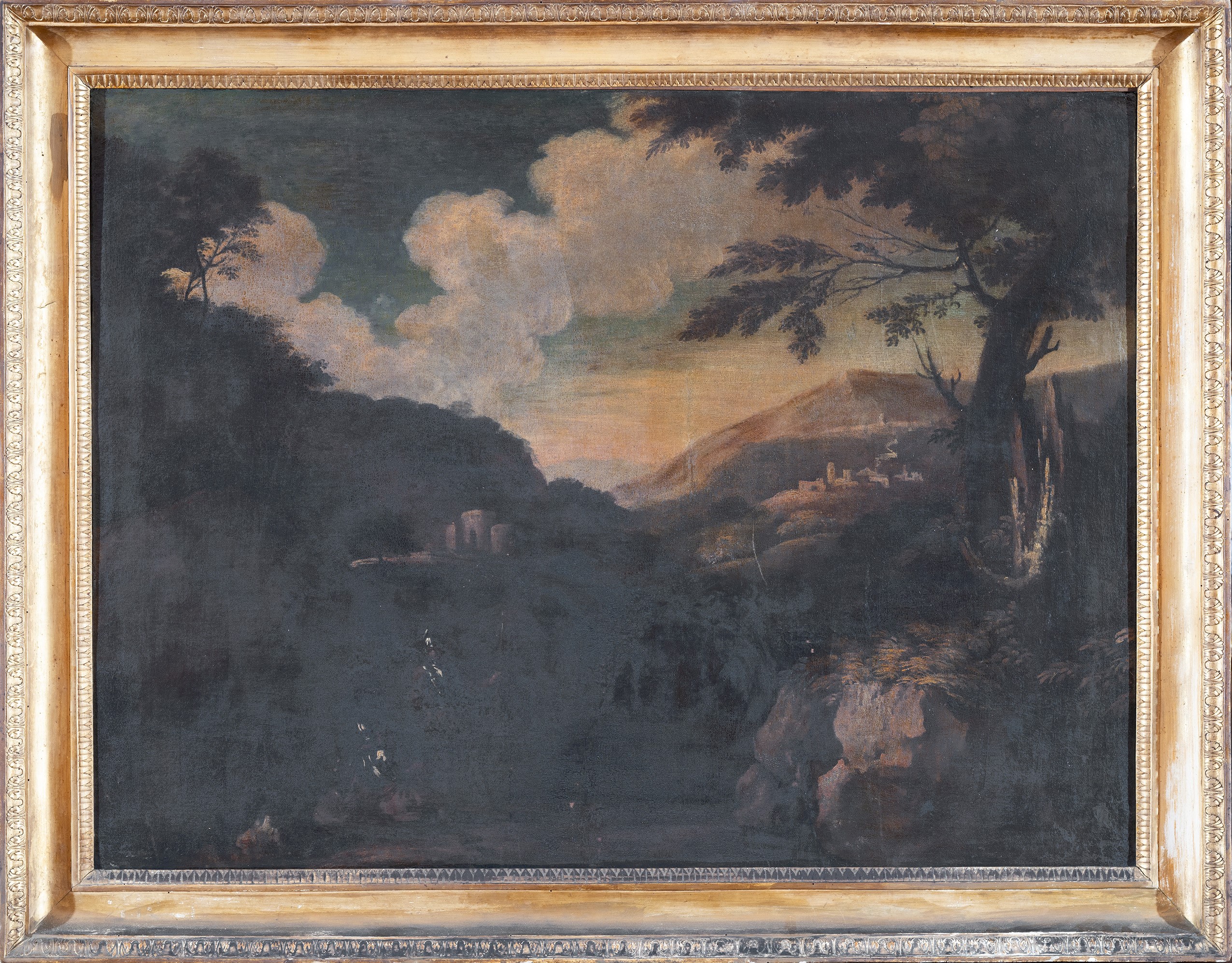 Armigeri a riposo nei pressi di uno stagno in un paesaggio roccioso