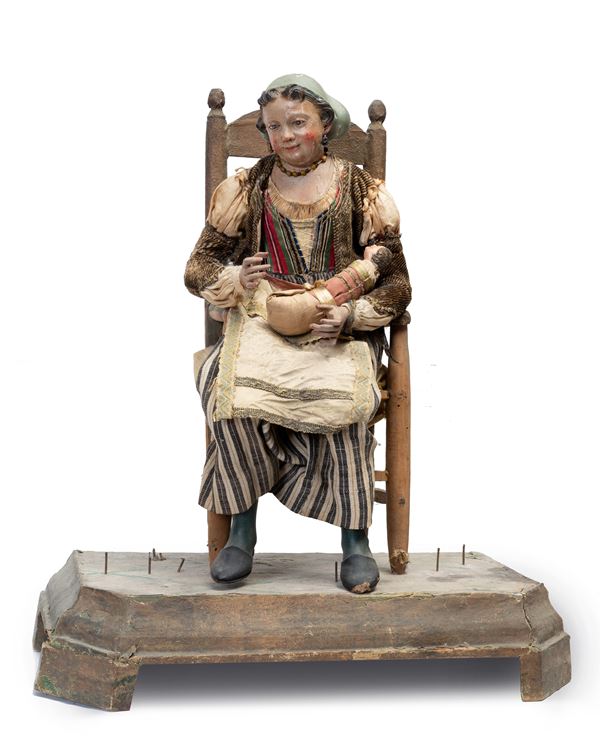 Manifattura napoletana, inizi del XIX secolo - Procida woman sitting with figure of baby in swaddling clothes