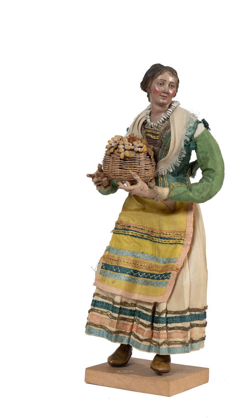 Giovane donna con cesta d'uva