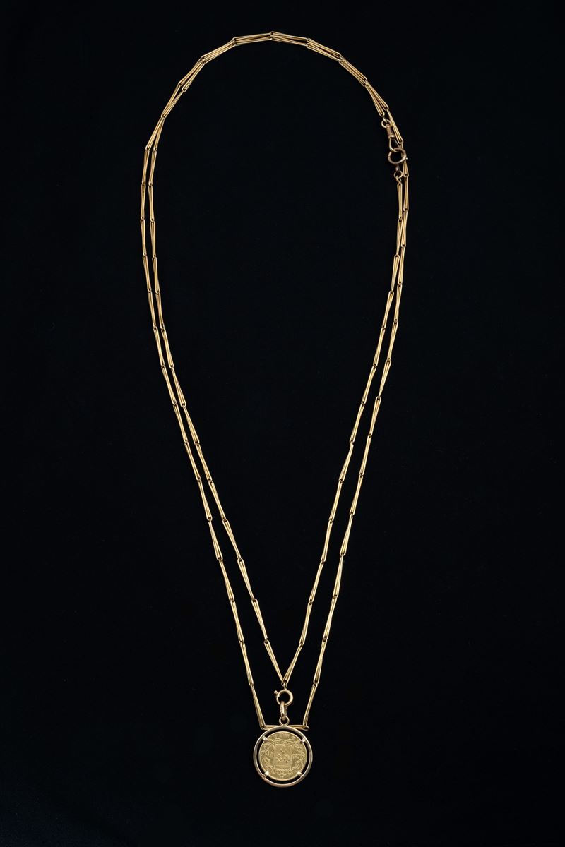 Lunga collana con moneta antica