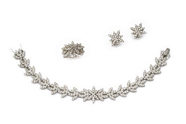 Parure a maglie stilizzate a motivo floreale  - in oro bianco 18 carati - Auction JEWELRY, WATCHES AND SILVER OBJECTS - Blindarte Casa d'Aste